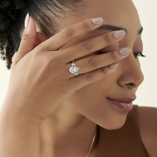 Pear Shaped Solitaire Ring with Marquise Diamond Accents