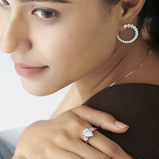 Pear Shaped Solitaire Ring with Marquise Diamond Accents